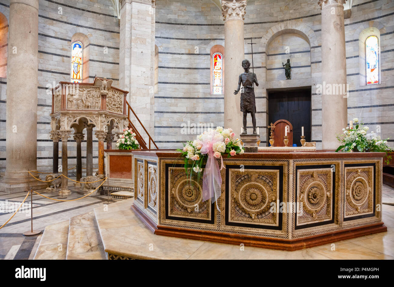 PISA, ITALY - MAY 31, 2018: Pisa Baptistery of St. John (Pisa Baptistry) at Piazza dei Miracoli (Piazza del Duomo) interior with  octagonal font by Gu Stock Photo