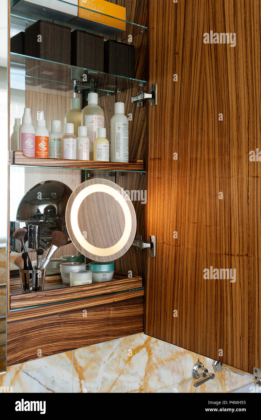 Shaving mirror in bathroom cupboard Stock Photo