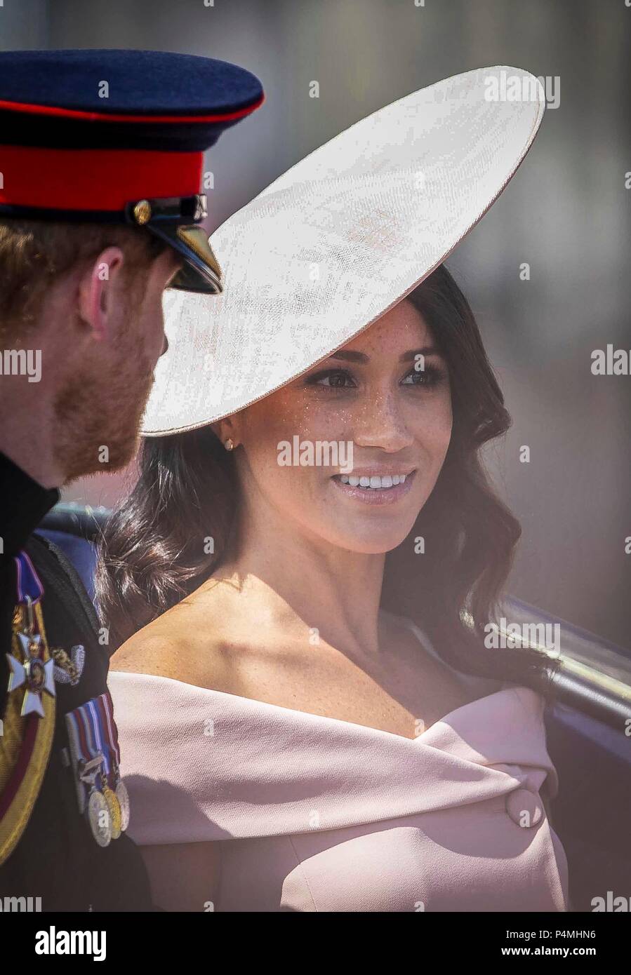Prince Harry, Duke of Sussex, Meghan, Duchess of Sussex, take part in the carriage procession down the Mall during the annual Trooping The Colour parade.on June 19, 2018 in London, England. Trooping the Colour is a military parade to mark Queen Elizabeth II's official birthday and dates back to the time of Charles II in the 17th Century when the Colours of a Regiment were used as a rallying point in battle. Stock Photo