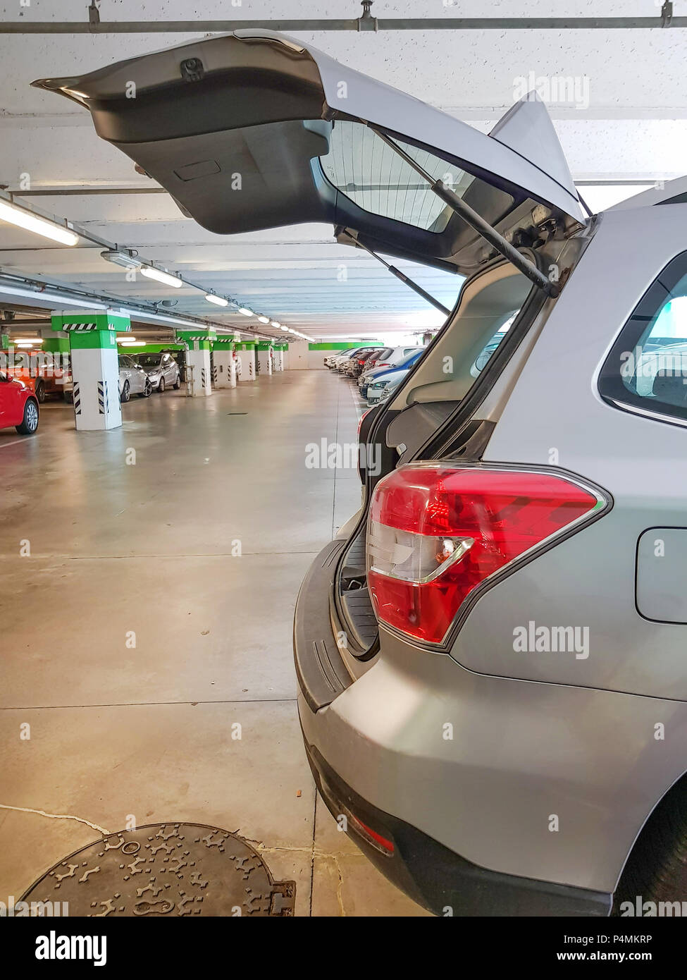 Hatchback car, open car trunk in parking car under shopping mall Stock