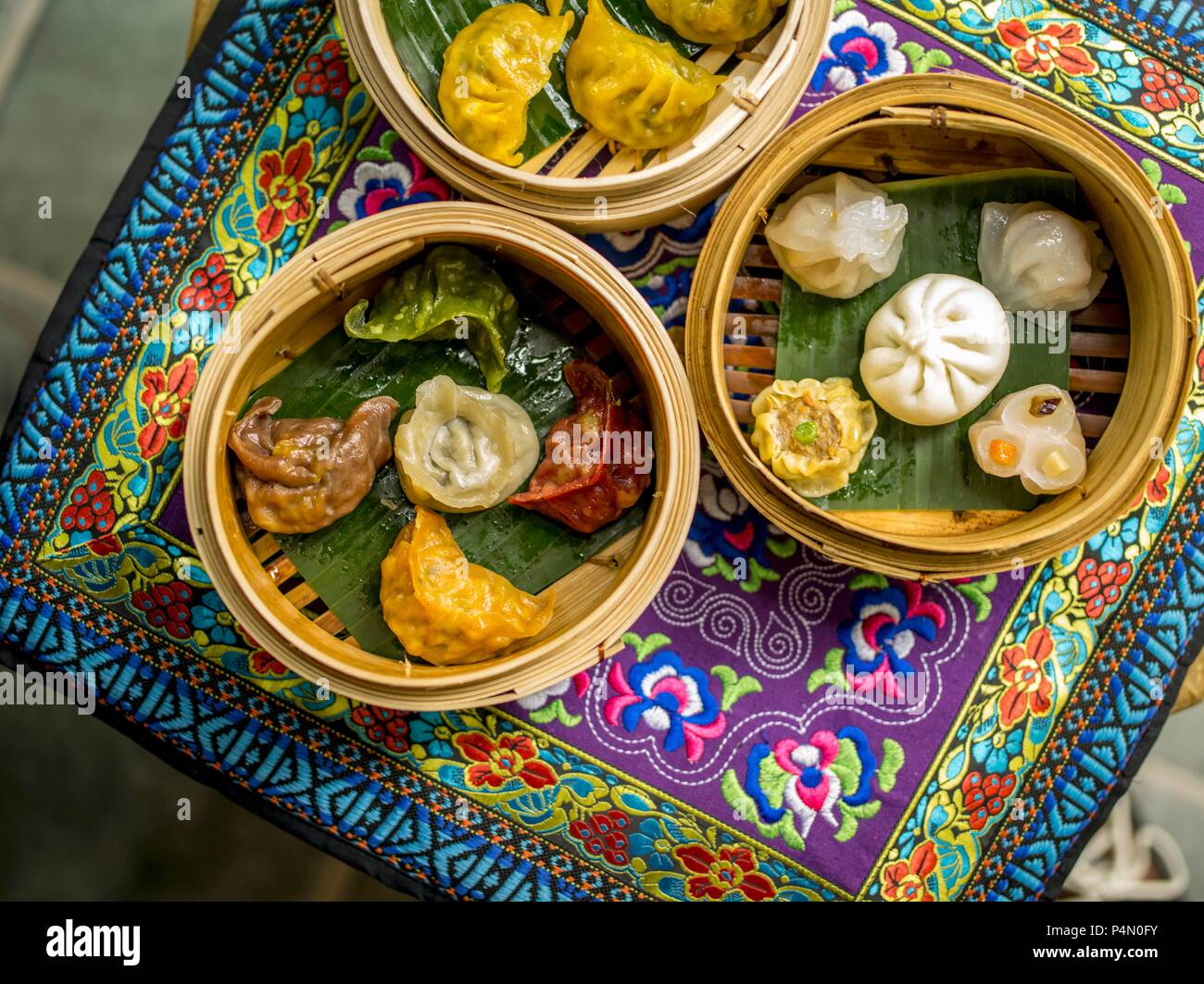 Various stuffed dumplings in bamboo steamers (Asia) Stock Photo