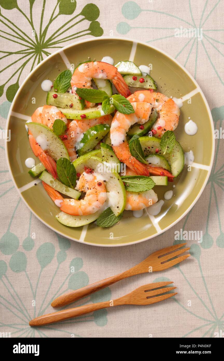 Prawn salad with cucumber, apple, mint and red peppercorns Stock Photo