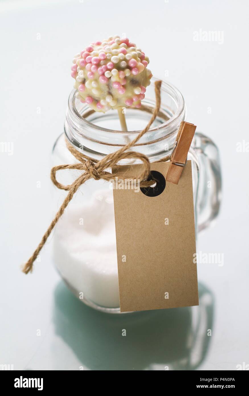 Cake pops with a white chocolate glaze and sugar beads Stock Photo