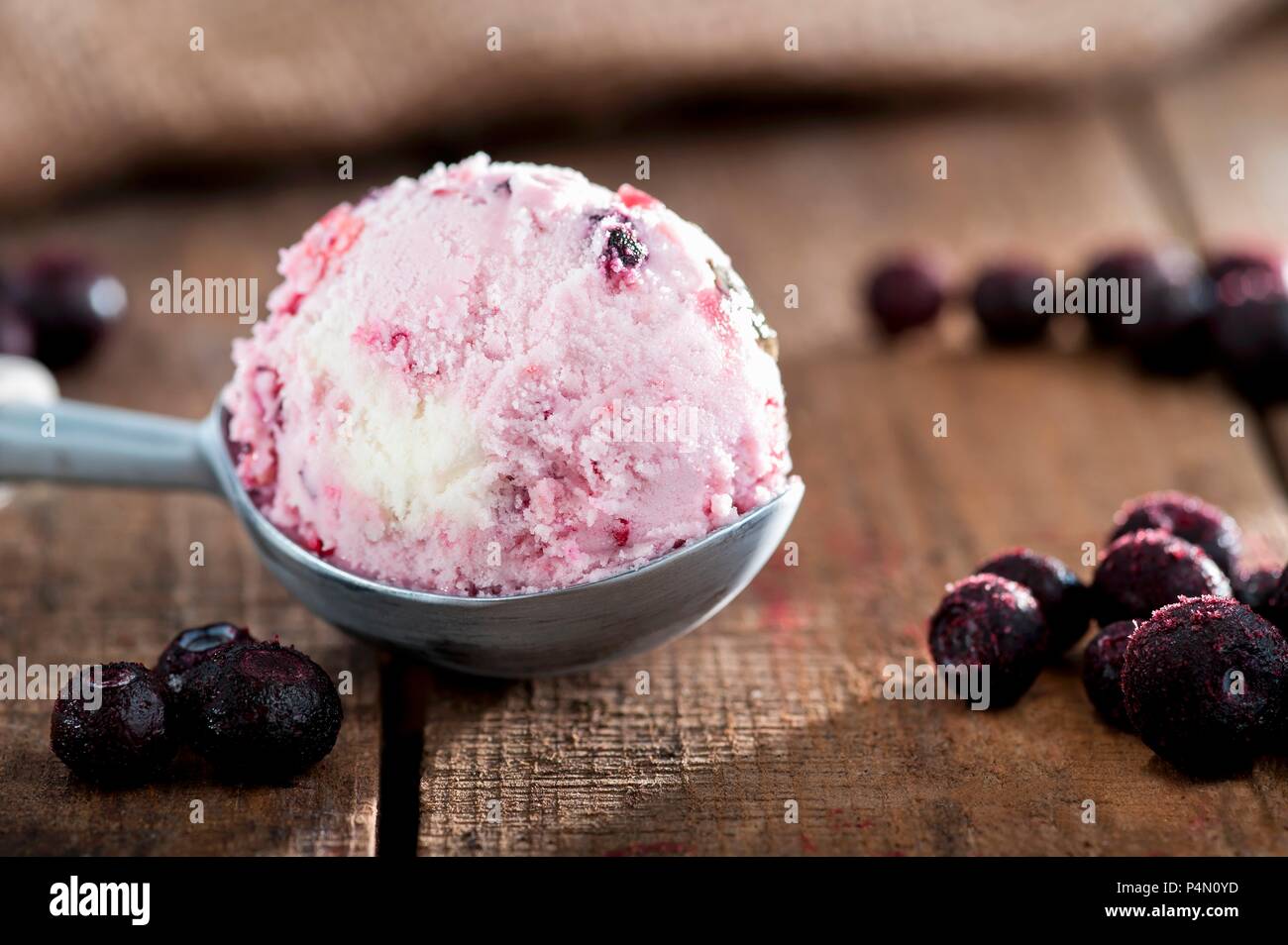 Blueberry ice cream and frozen blueberries Stock Photo