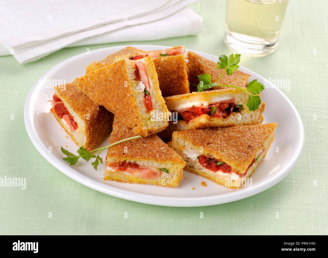 Fried sandwiches filled with roasted tomatoes Stock Photo