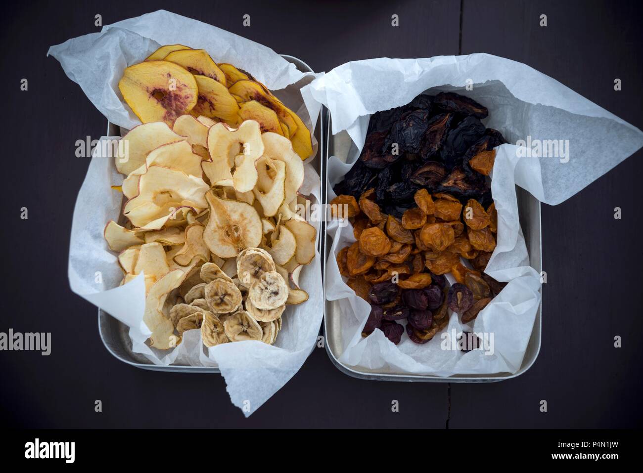 Peach, apple, pear and banana chips, dried plums, mirabelles and grapes Stock Photo