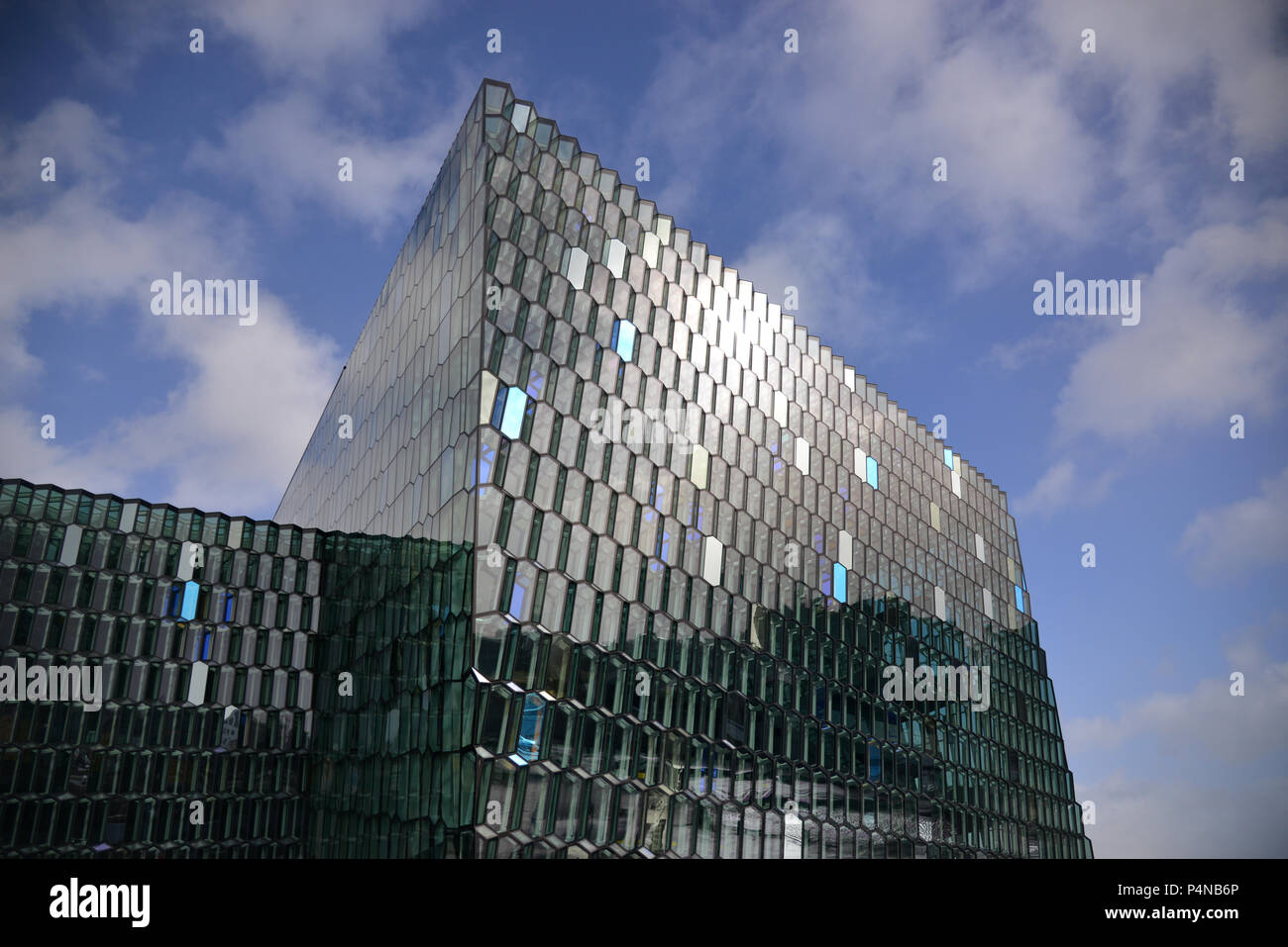 Sunlight reflecting in the glass panels of the famous Harpa concert hall in Reykjavik, Iceland Stock Photo