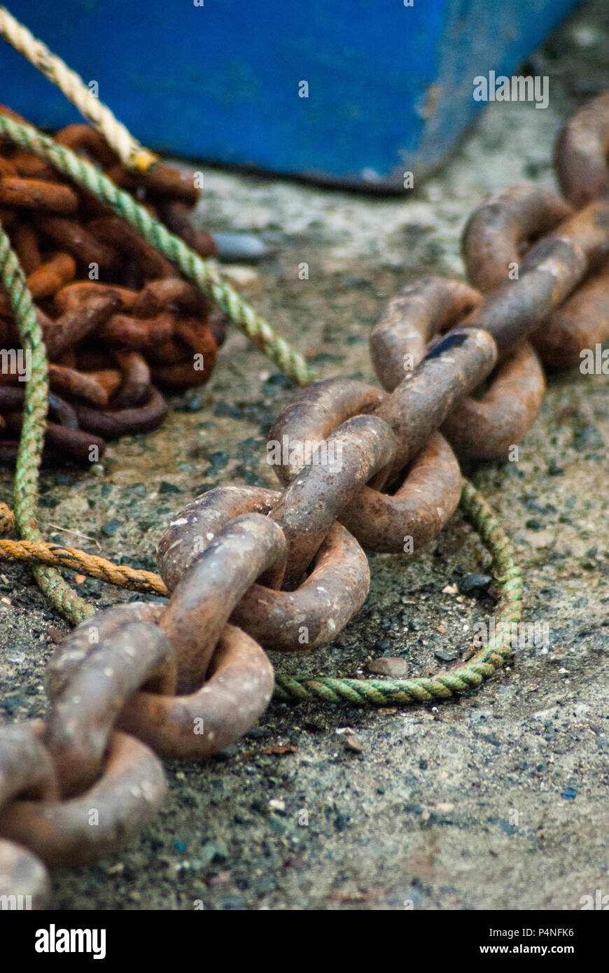 An anchor chain with rope on the floor Stock Photo - Alamy