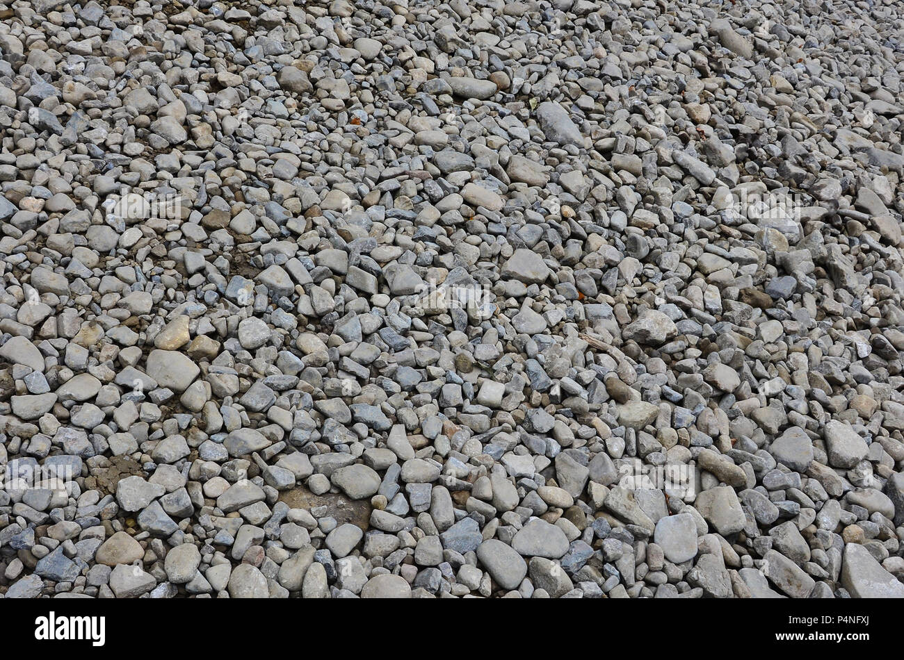 Texture of many crushed stones. Crushed stone is a solid base material