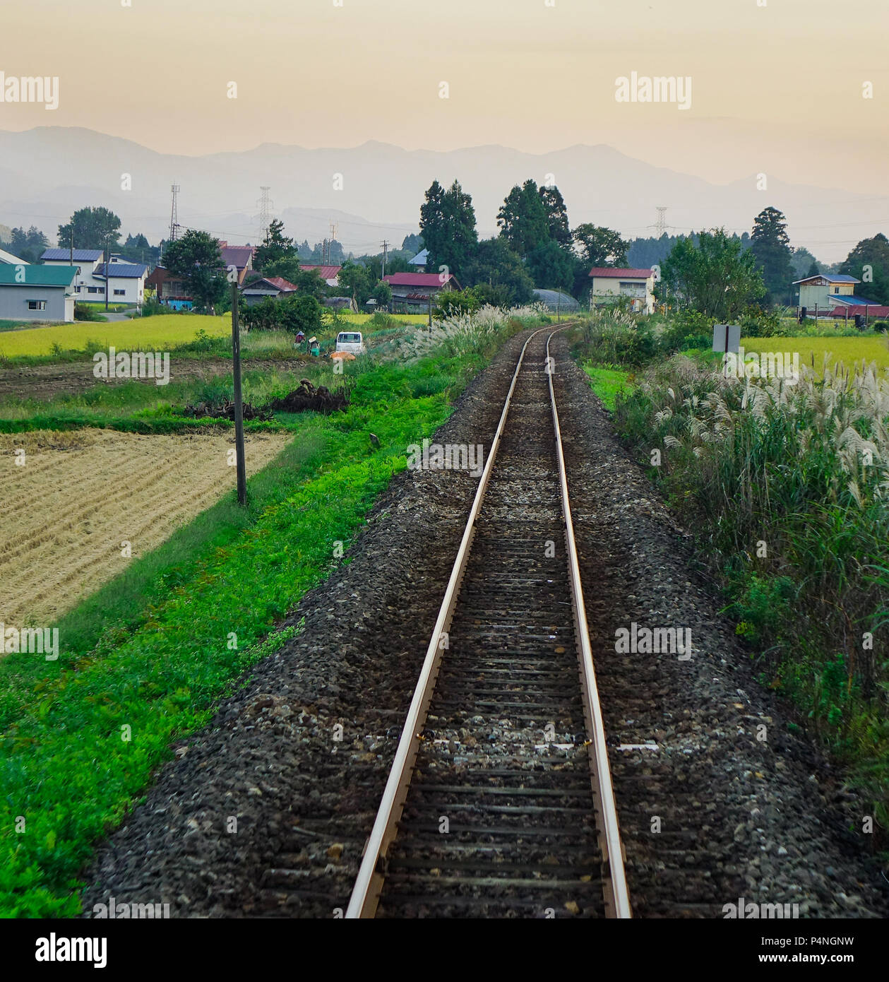 Rural scenery with the rail track at summer day in Akita, Japan Stock ...