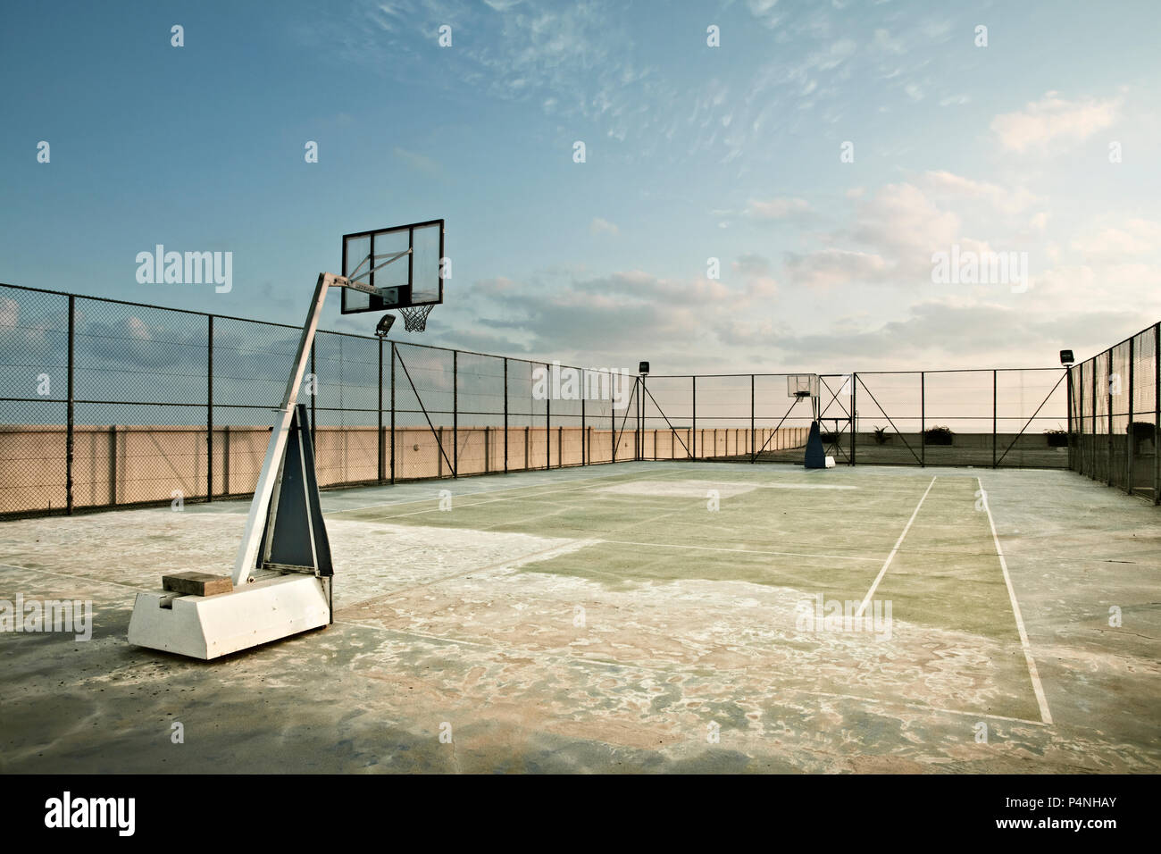 Transparent basketball board in the open air at twilight Stock Photo