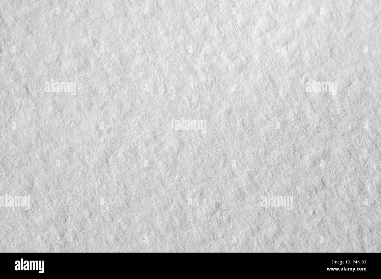 Texture of thick paper intended for watercolor painting. Macro snapshot