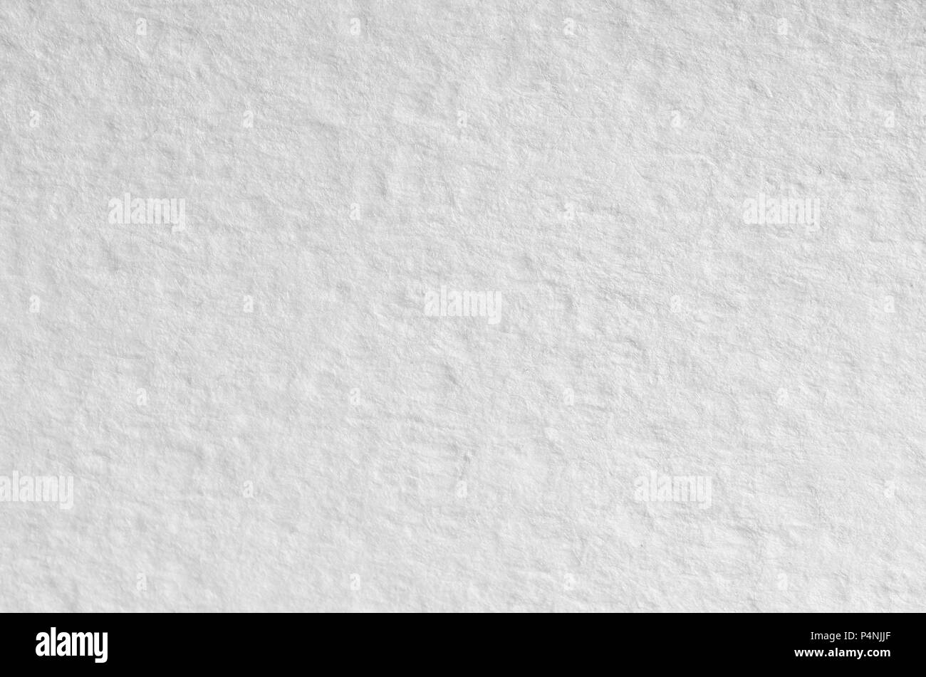 Texture of thick paper intended for watercolor painting. Macro snapshot of  details of the relief paper structure Stock Photo