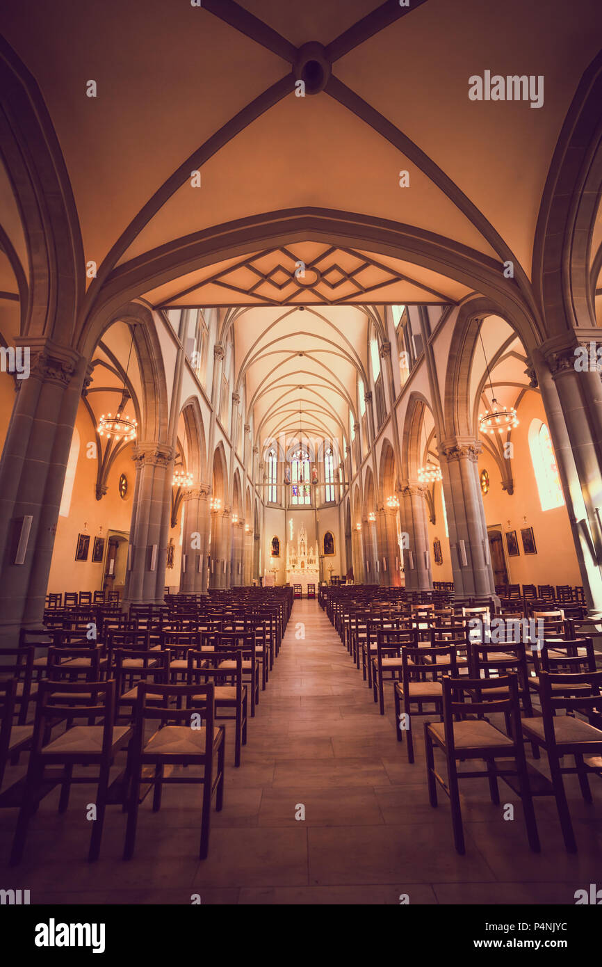 Illuminated Roman Catholic Church with Stained Glass Windows Stock Photo Alamy