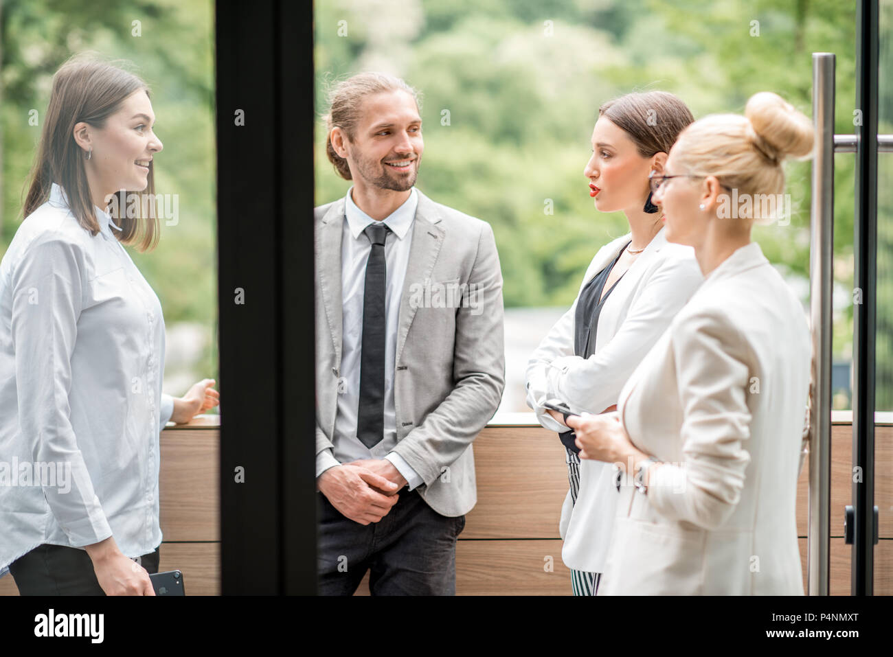 Business people on the office balcony during a break Stock Photo