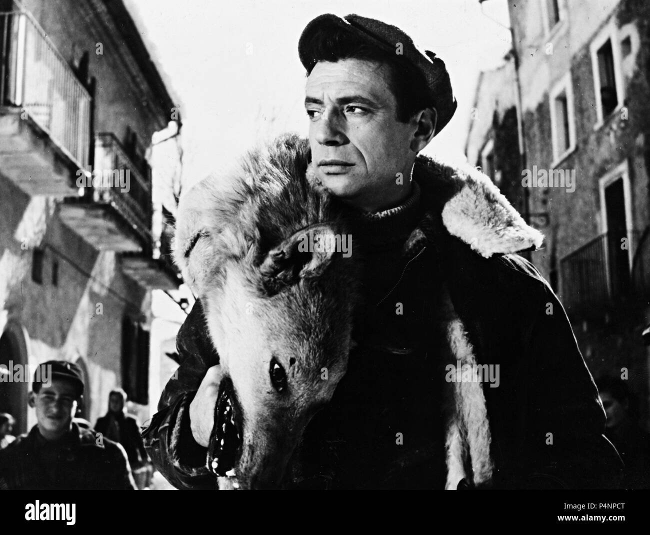 Original Film Title: UOMINI E LUPI. English Title: MEN AND WOLVES. Film  Director: GIUSEPPE DE SANTIS. Year: 1957. Stars: YVES MONTAND. Credit:  TITANUS / Album Stock Photo - Alamy