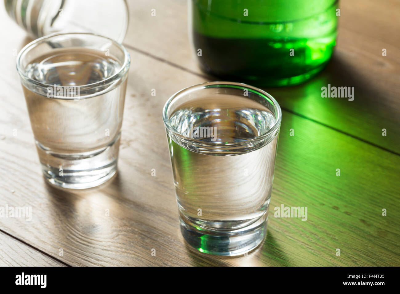 Alcoholic Clear Distilled Korean Soju in a Shot Glass Stock Photo