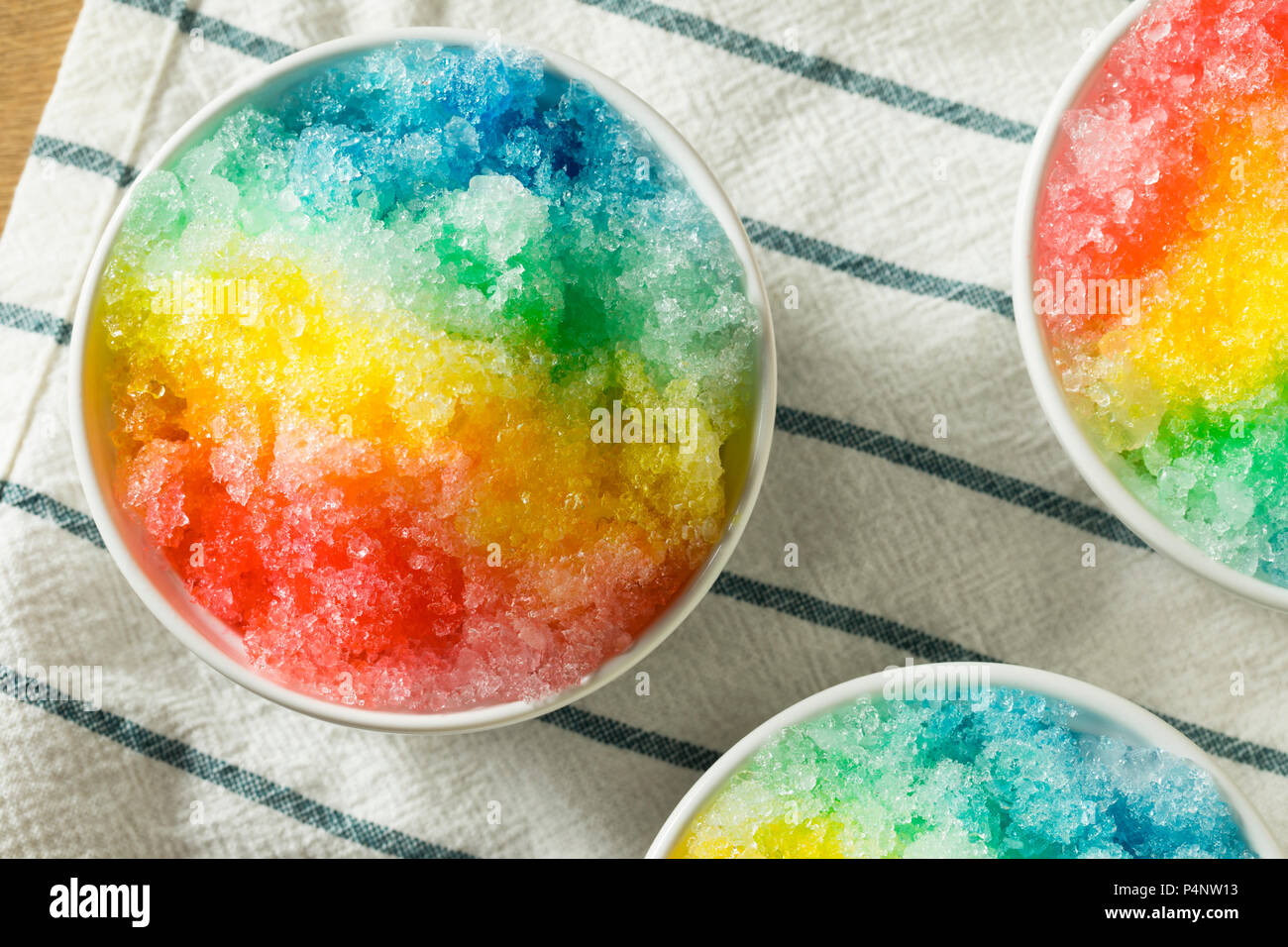 Sweet Homemade Shaved Rainbow Hawaiian Ice in a Bowl Stock Photo