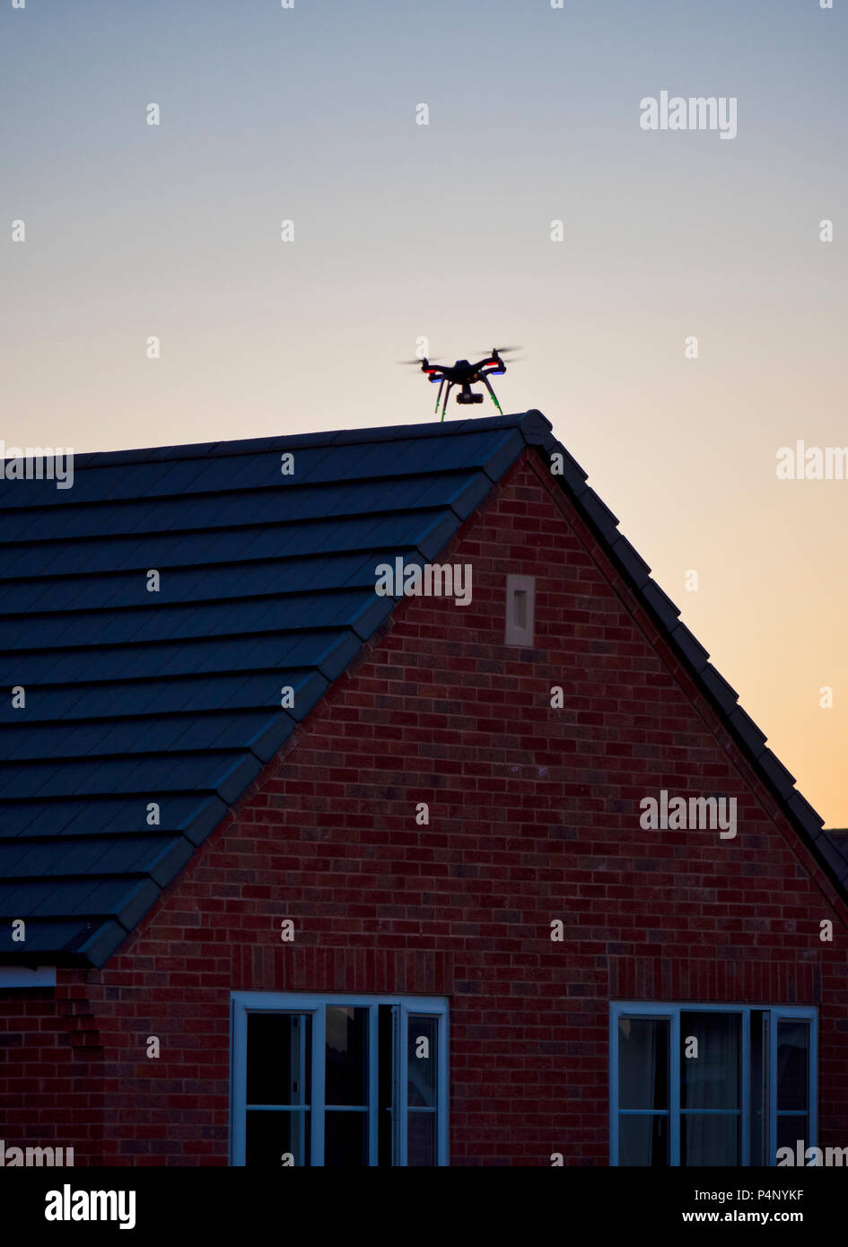 Derbyshire, UK. 22nd June 2018. Drone being flown dangerously close to a property on a built-up housing estate in Ashbourne, Derbyshire therefore not complying to The Drone Code Credit: Doug Blane/Alamy Live News Stock Photo
