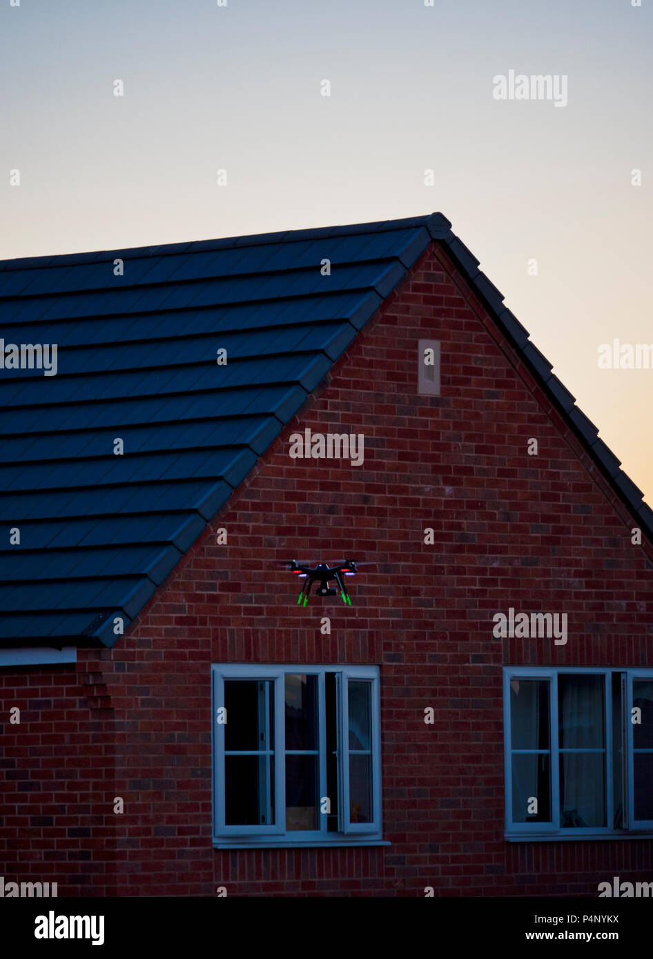 Derbyshire, UK. 22nd June 2018. Drone being flown dangerously close to a property on a built-up housing estate in Ashbourne, Derbyshire therefore not complying to The Drone Code Credit: Doug Blane/Alamy Live News Stock Photo