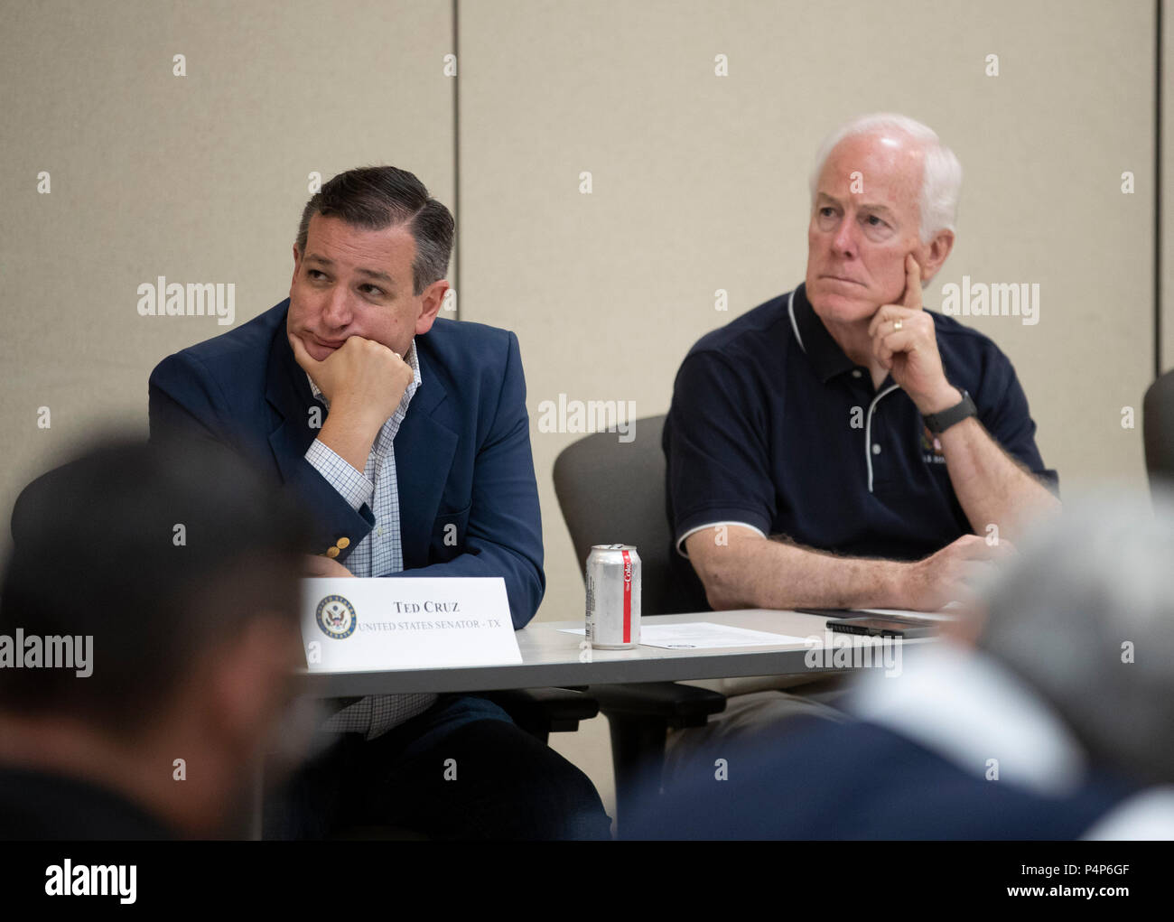 U.S. Senators Ted Cruz, left, and John Cornyn listen as federal and Texas officials and stakeholders meet in a round-table discussion of the immigration crisis hitting the Texas-Mexico border. Confusion and public outrage reigned regarding the Trump administration's policy of separating undocumented immigrant parents from their children after crossing into the U.S. from Mexico. Stock Photo