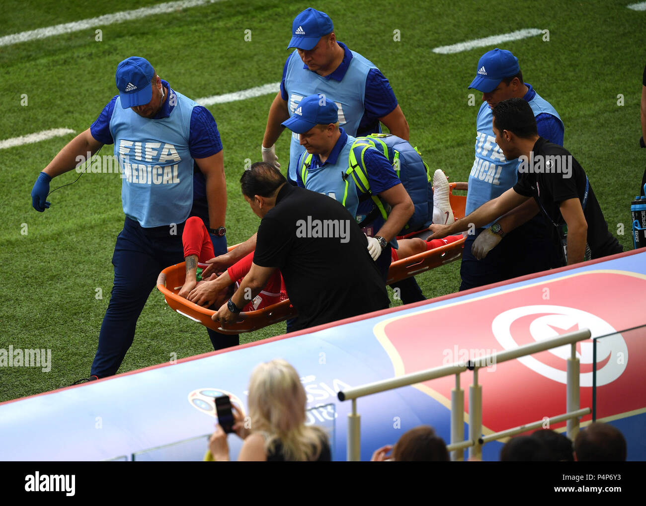 Moscow, Russia. 23rd June, 2018. Dylan Bronn of Tunisia is carried out of the pitch after his injury during the 2018 FIFA World Cup Group G match between Belgium and Tunisia in Moscow, Russia, June 23, 2018. Credit: Wang Yuguo/Xinhua/Alamy Live News Stock Photo