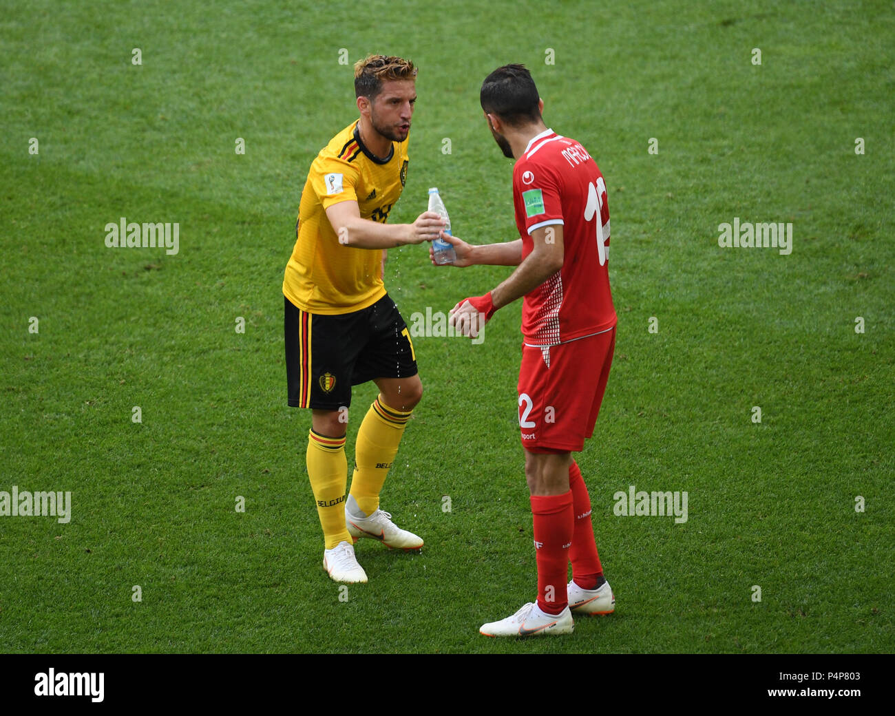 Moscow, Russia. 23rd June, 2018. Dries Mertens (L) of Belgium gives a bottle of water to Ali Maaloul of Tunisia during the 2018 FIFA World Cup Group G match between Belgium and Tunisia in Moscow, Russia, June 23, 2018. Credit: Wang Yuguo/Xinhua/Alamy Live News Stock Photo