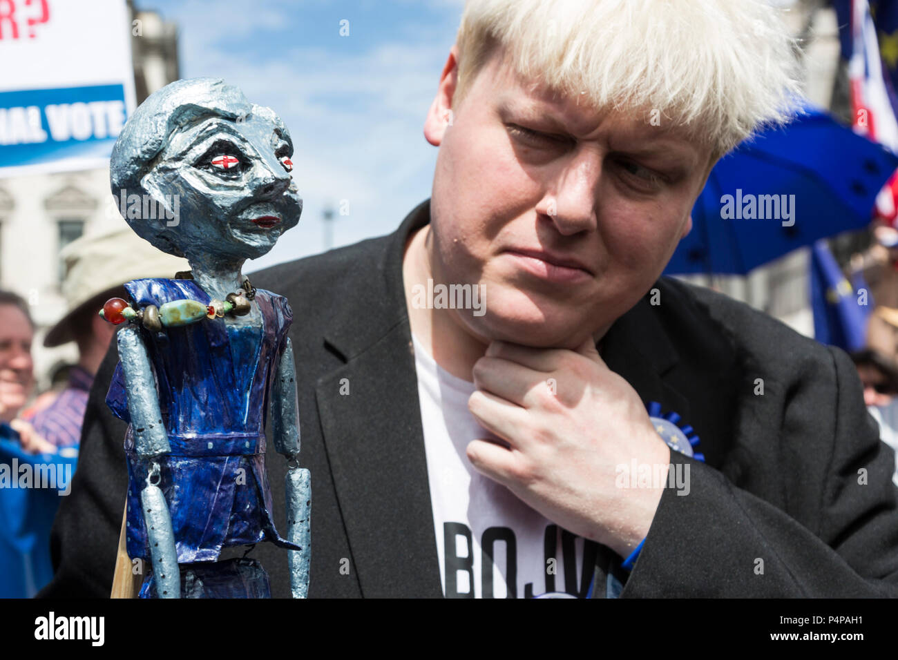London, UK. 23 June 2018. FauxBoJo, Boris Johnson impersonator with a Theresa May puppet.  Remain supporters and protesters gather in Pall Mall for an Anti-Brexit March and Rally. Photo: Bettina Strenske/Alamy Live News Stock Photo