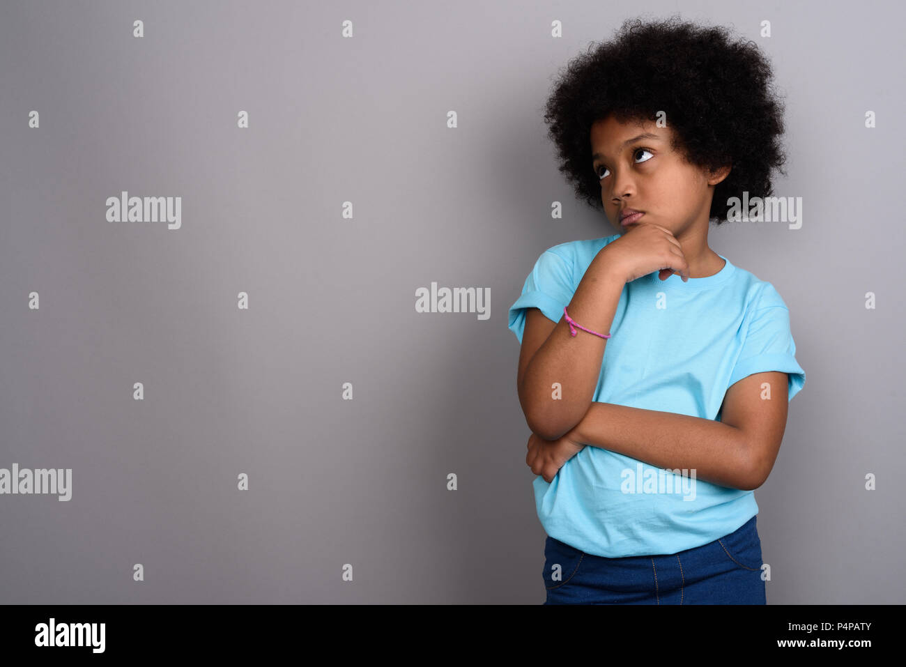 Beautiful black girl child afro hi-res stock photography and