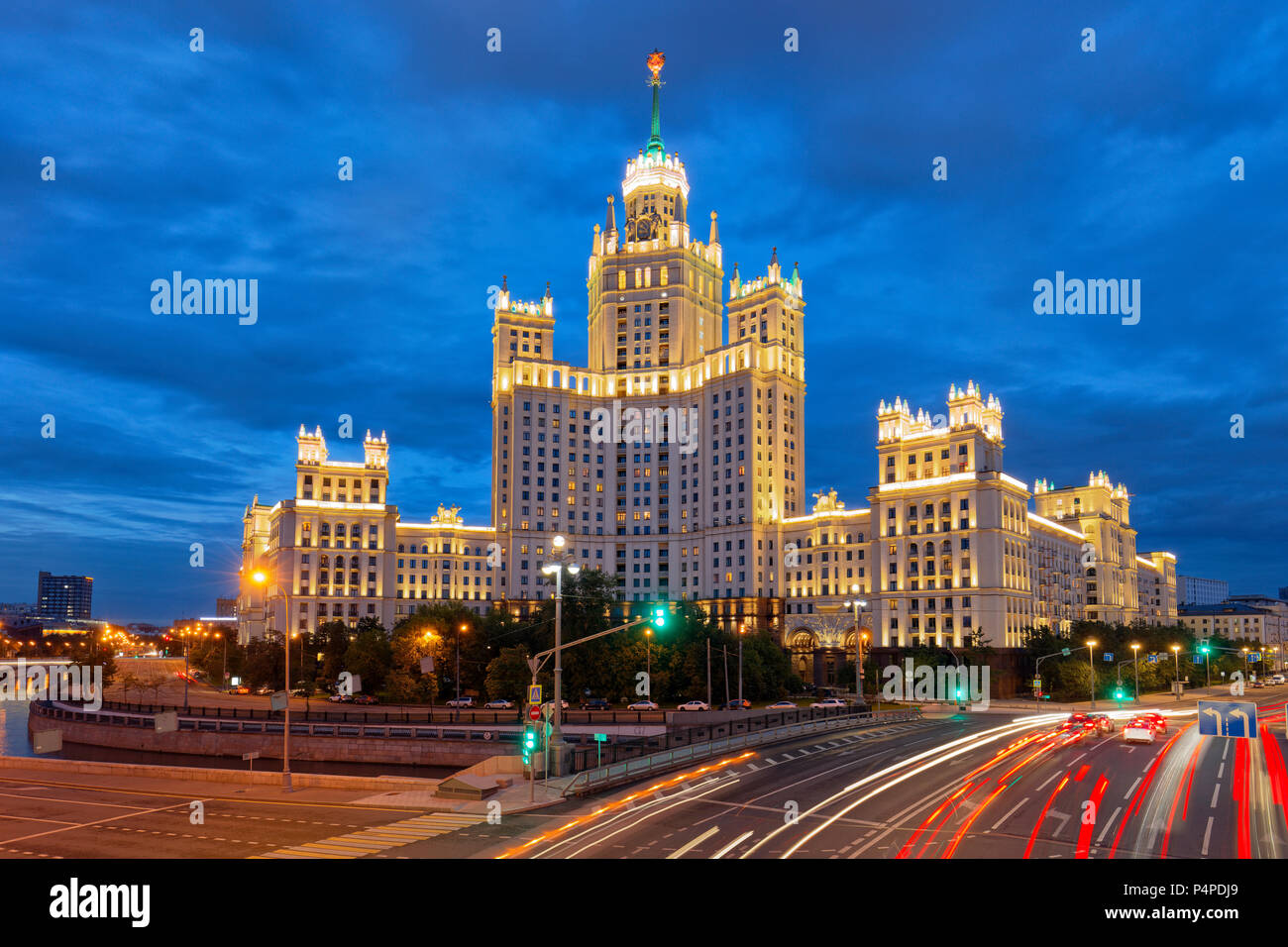 Residential high-rise building on Kotelnicheskaya Embankment illuminated at dusk. Moscow, Russia. Stock Photo