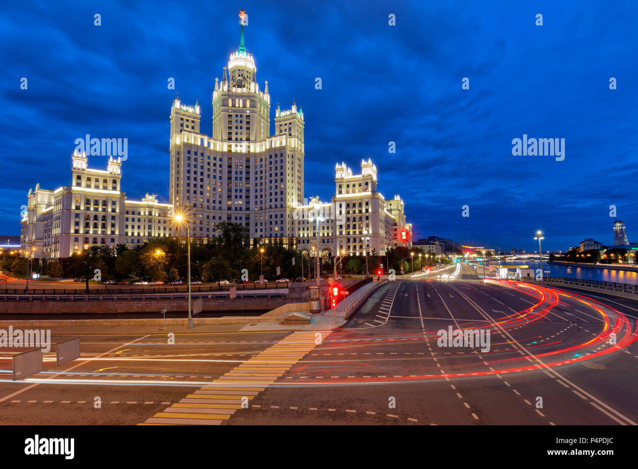 Residential high-rise building on Kotelnicheskaya Embankment illuminated at dusk. Moscow, Russia. Stock Photo