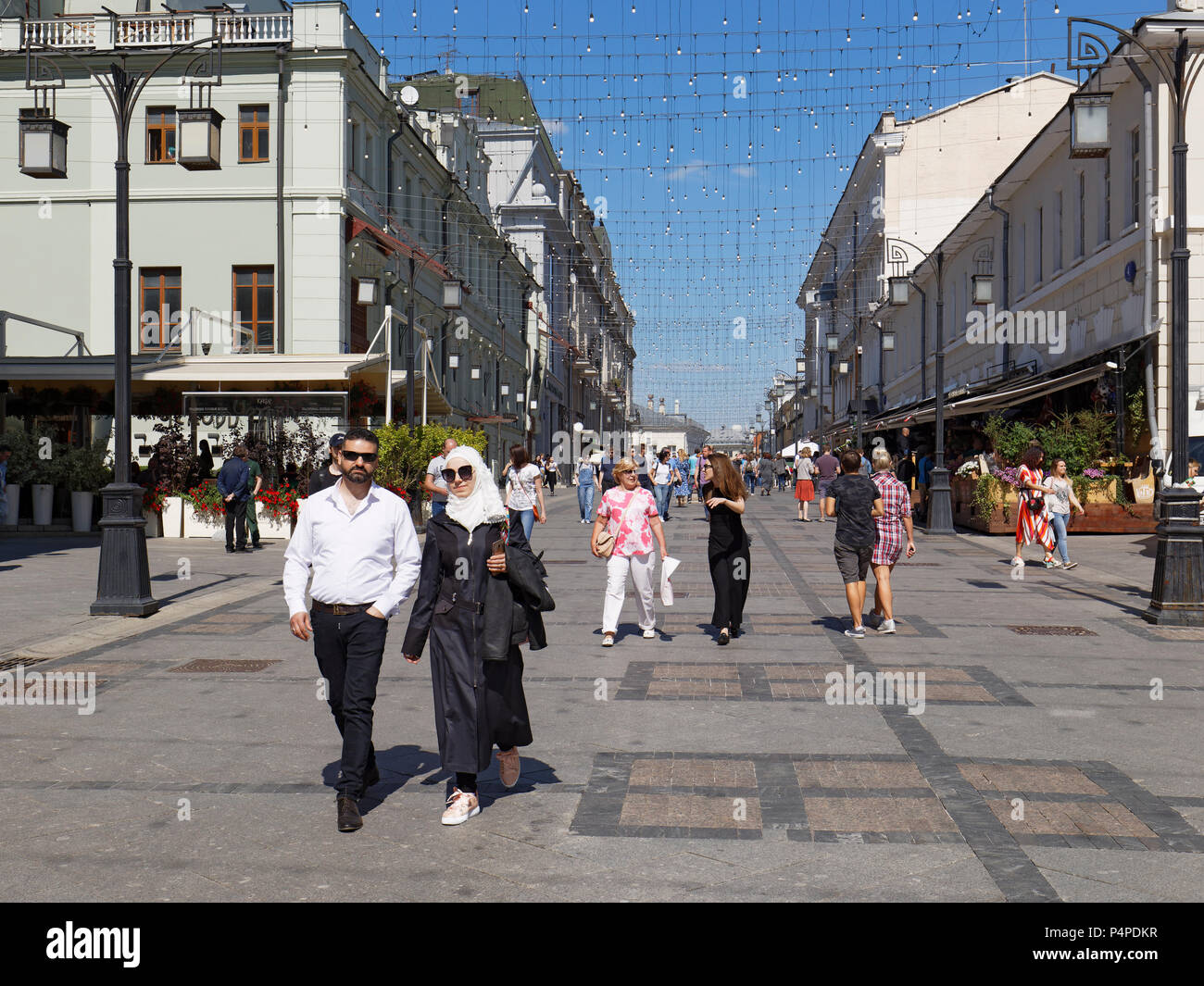 Muslim woman walking street hi-res stock photography and images - Alamy