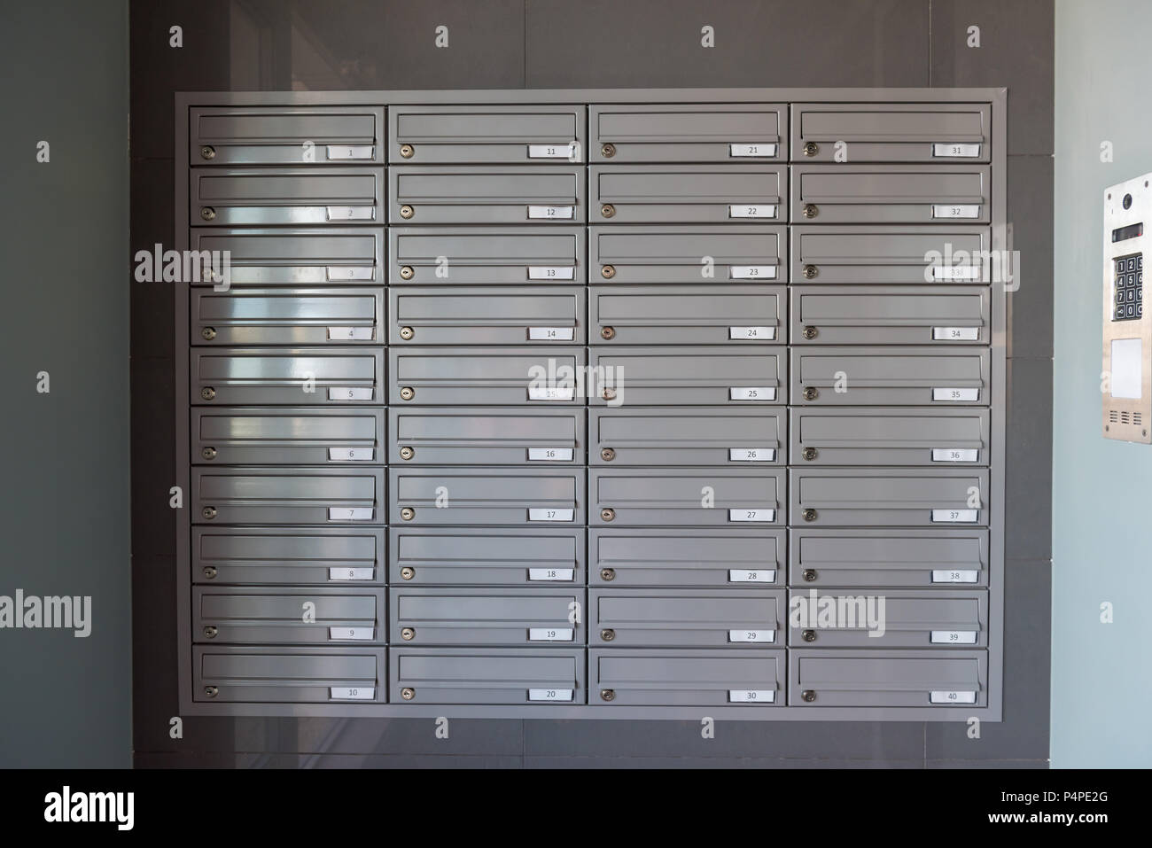 Mailboxes on the wall in the entrance of an apartment building Stock