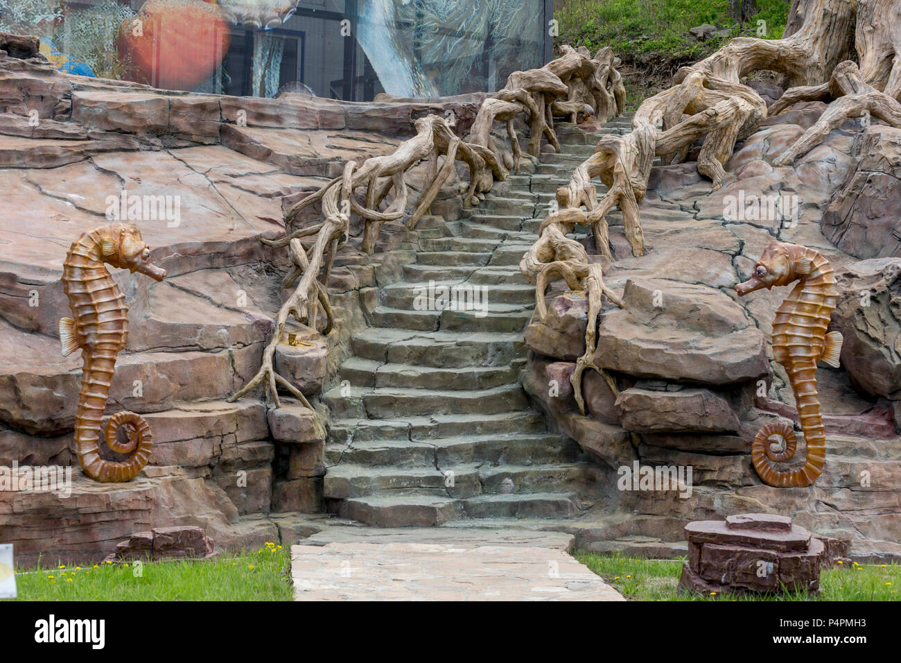 Russia, Vladivostok, 05/26/2018. Sculpture of a Seahorse (Hippocampus) and stylish staircase in a marine amusement park. Placed in amusement park of O Stock Photo