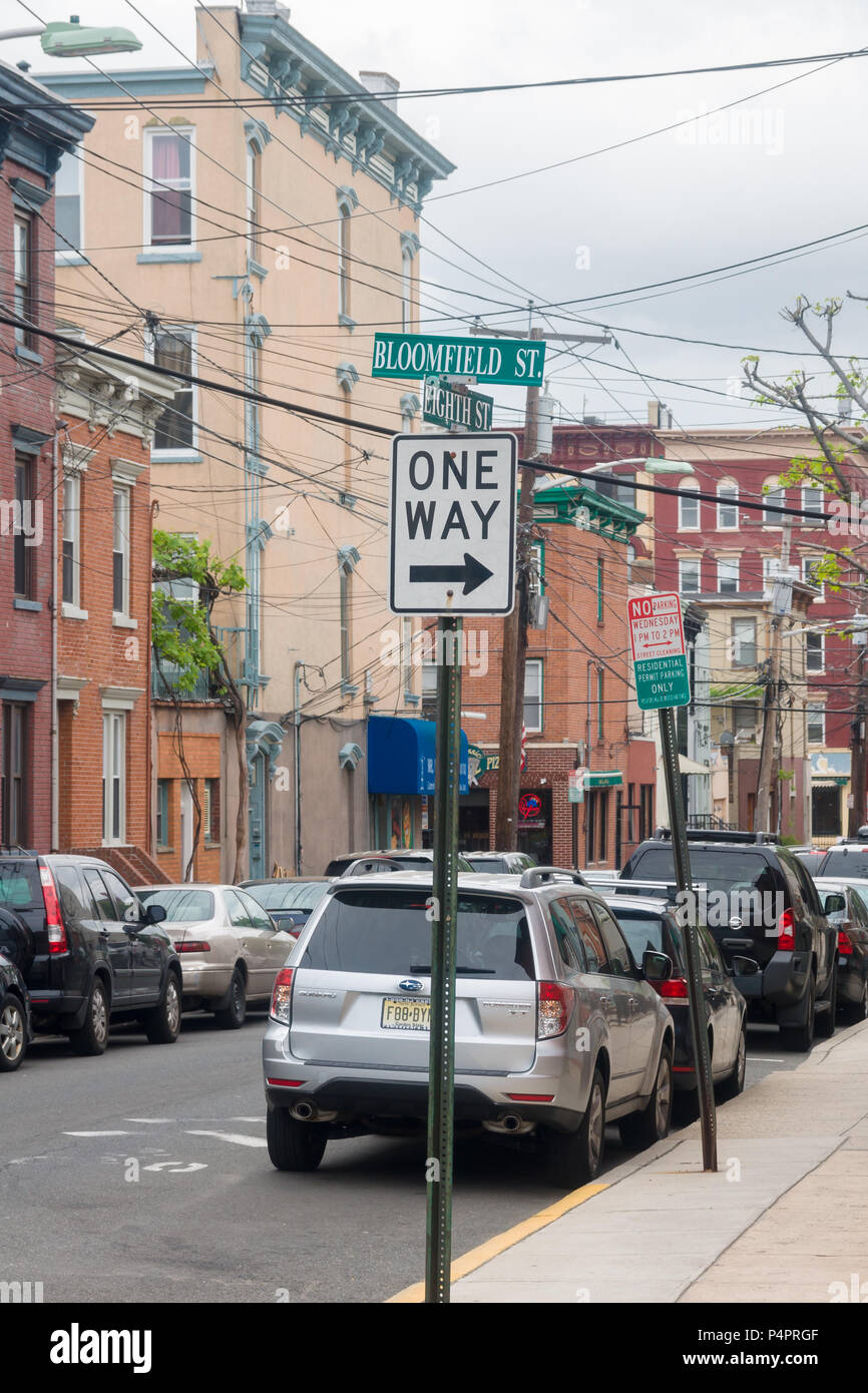 One way road sign on the junction of Bloomfield and Eighth street in Hoboken New Jerse Stock Photo
