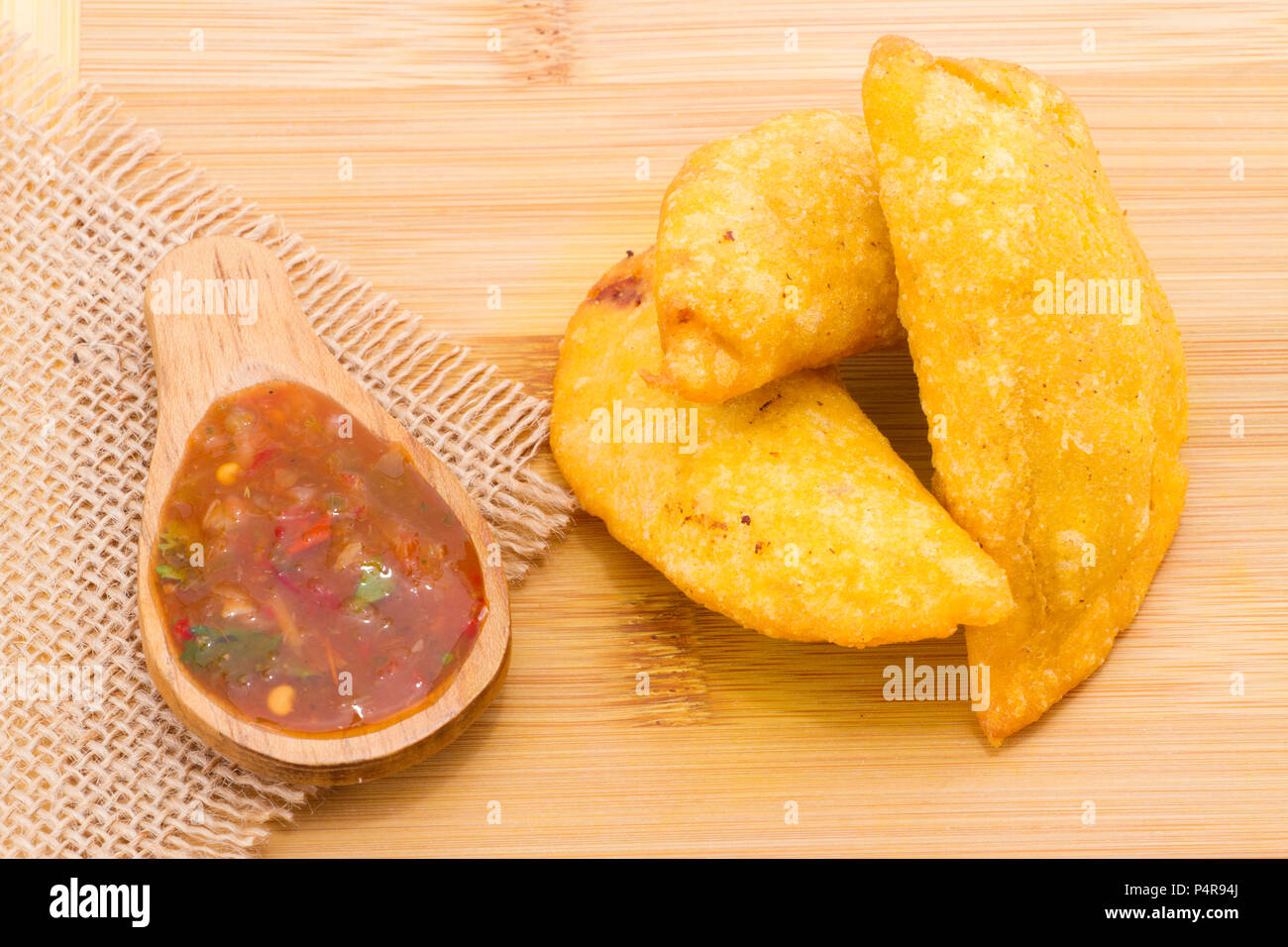 Colombian Empanada With Spicy Sauce On Wooden Background Typical Food Of Colombia Stock Photo Alamy