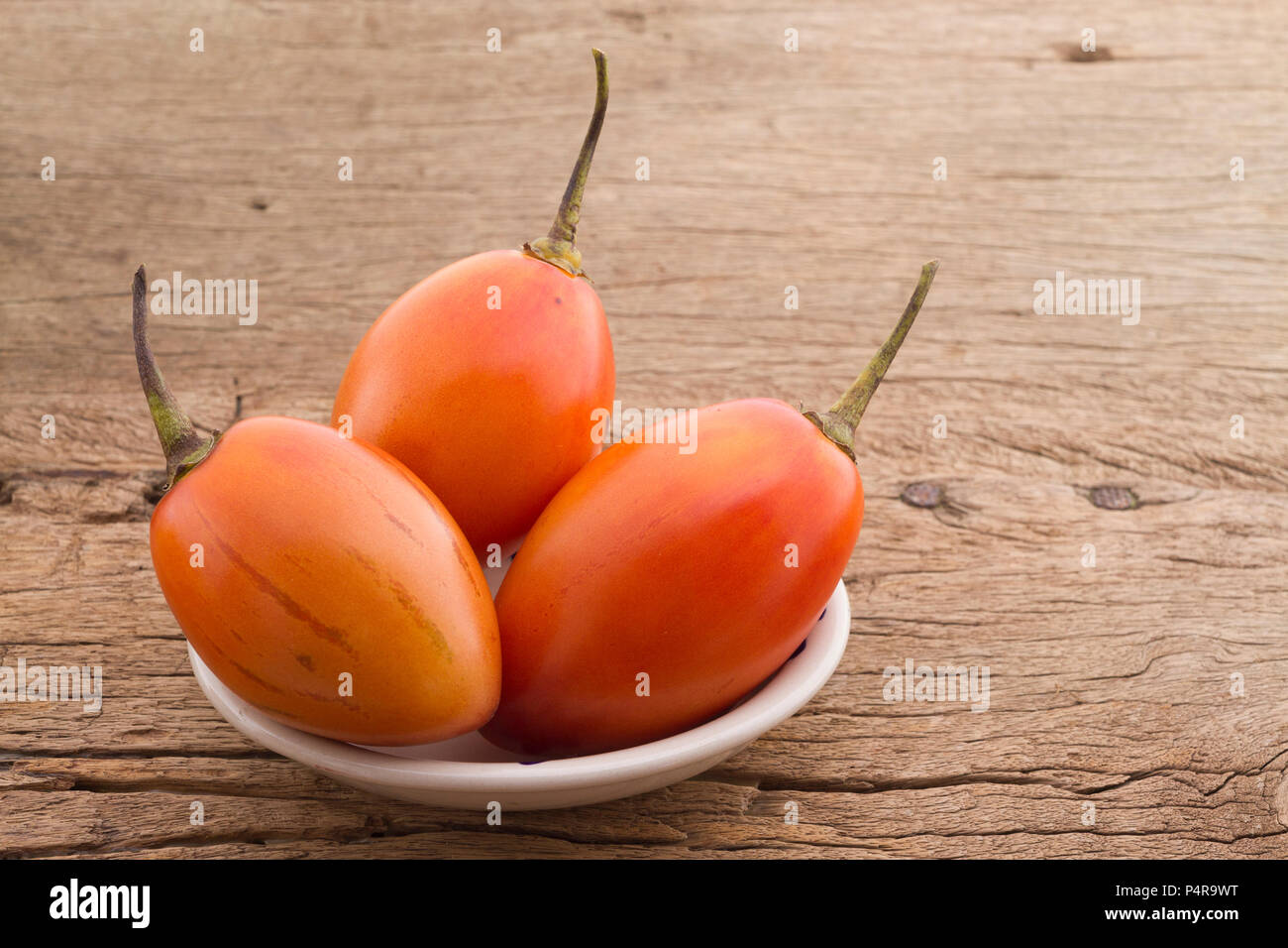 tree tomato fruits on the table (Solanum betaceum) Stock Photo