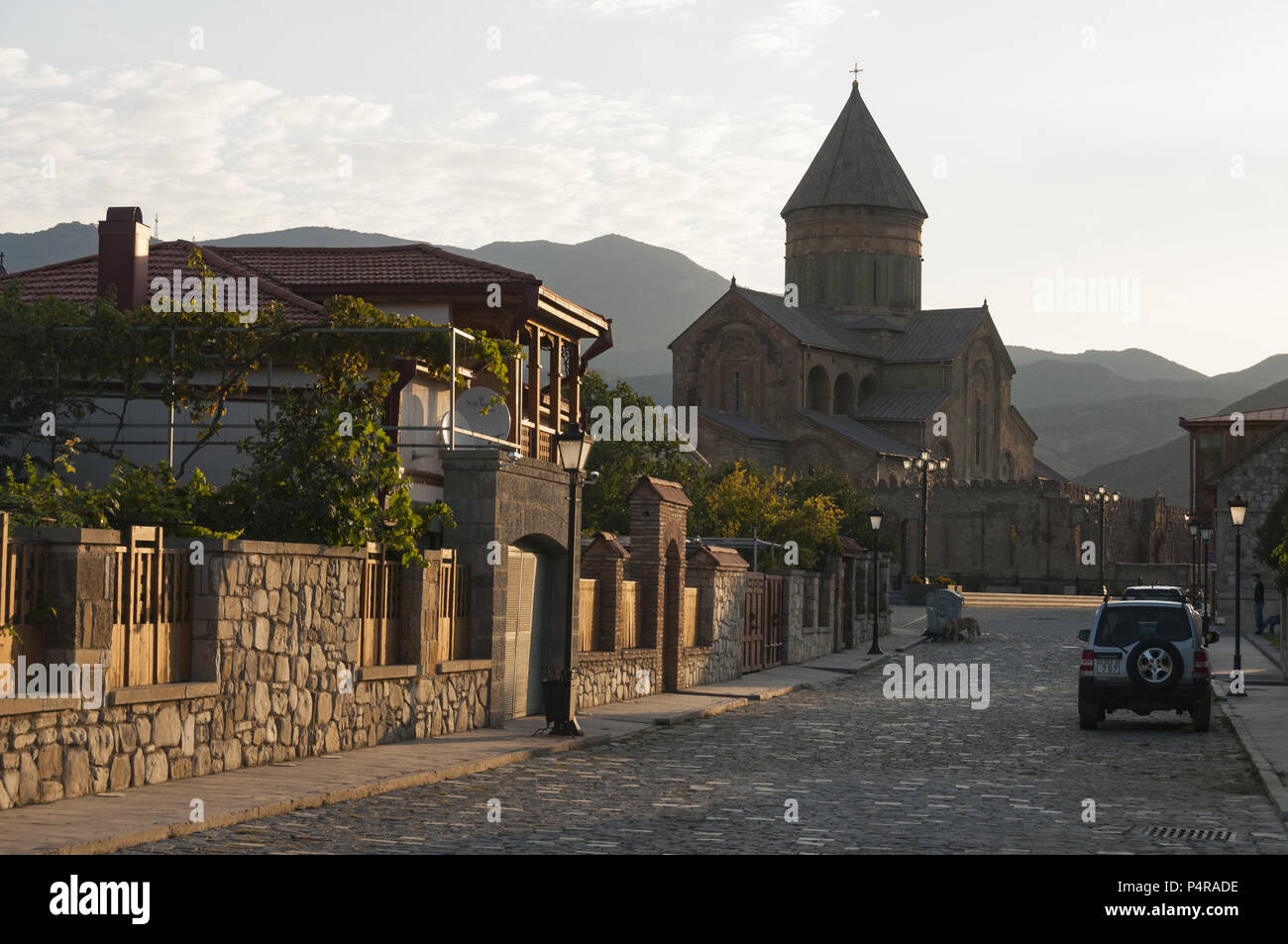 Georgia, Mtskheta, street scene with houses and church Stock Photo