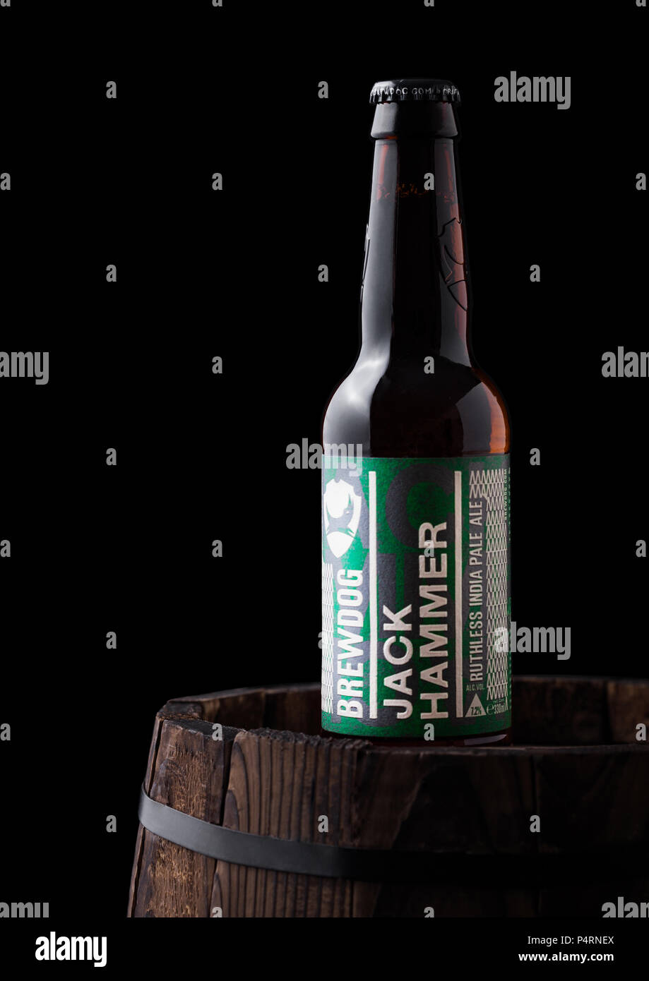 LONDON, UK - JUNE 06, 2018: Bottle of Jack Hammer indian pale ale beer, from the Brewdog brewery on old wooden barrel on black background. Stock Photo