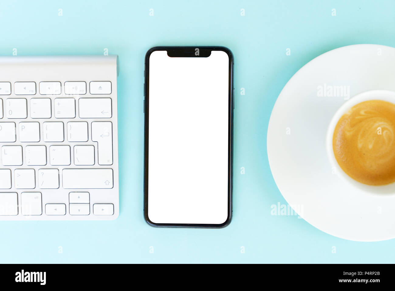 Home office desk with phone on blue Stock Photo Alamy