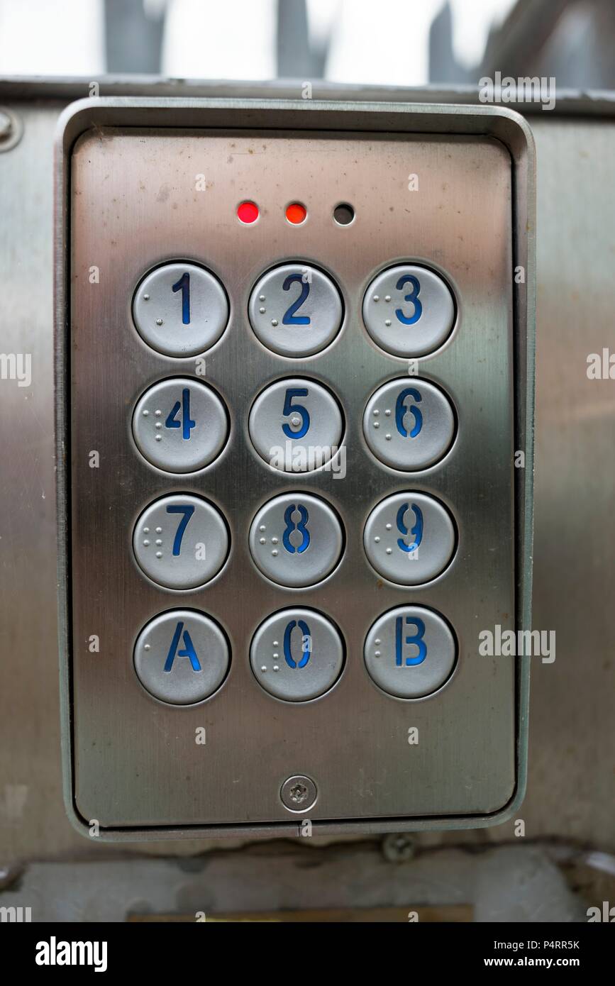 Intercom keypad with braille at entrance to industrial site Stock Photo ...