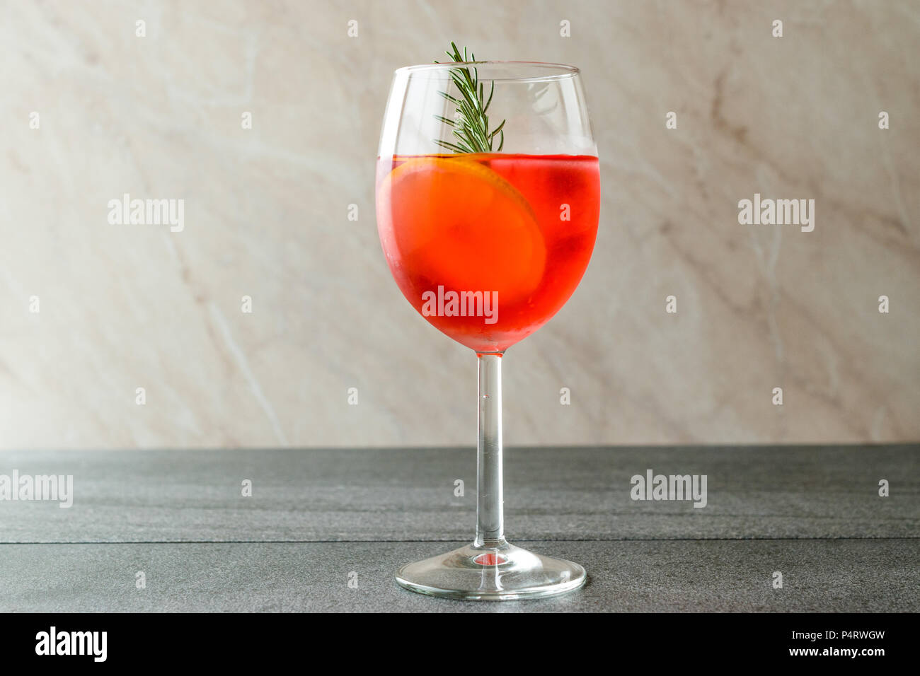 Aperol Spritz Cocktail with Orange Slice, Rosemary and Ice. Alcoholic