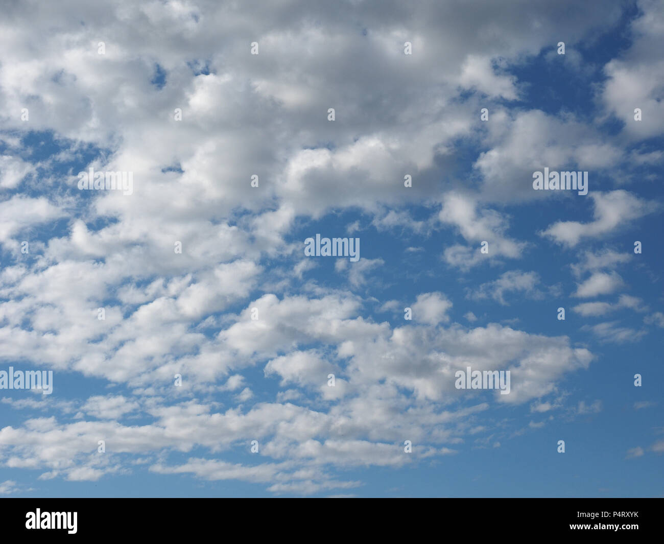 blue sky with clouds useful as a background Stock Photo - Alamy
