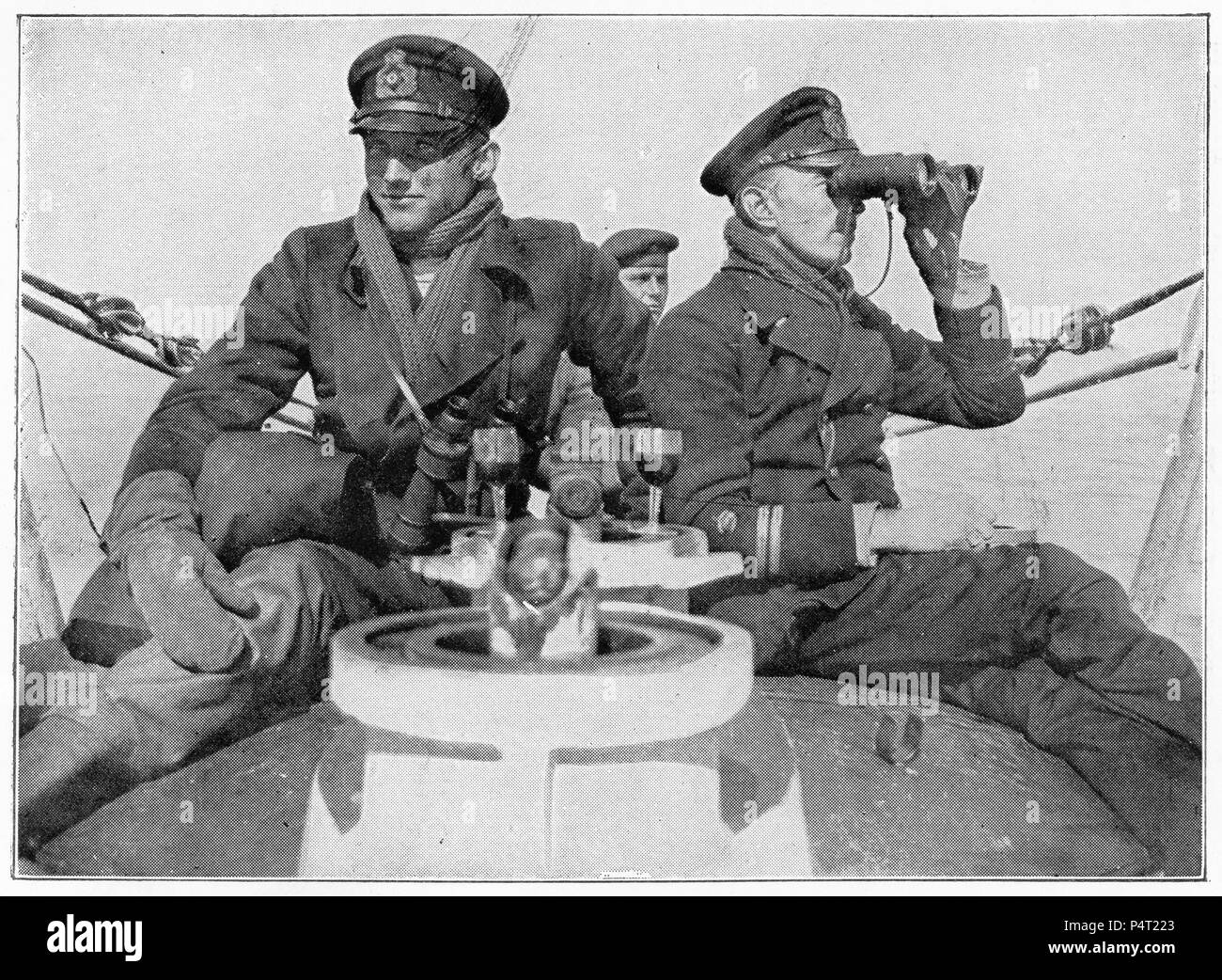 Halftone portrait of two German submarine officers, Lieutenants Ziegner and Usedon, returning to port on their bullet-ridden submarine. Stock Photo