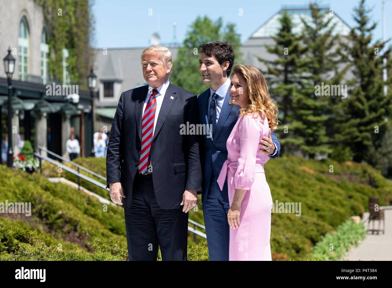 U.S. President Donald Trump is welcomed by Canadian Prime Minister Justin Trudeau and his wife Sophie Gregoire Trudeau on arrival for the G7 Summit June 8, 2018 in Charlevoix, Quebec, Canada. Stock Photo