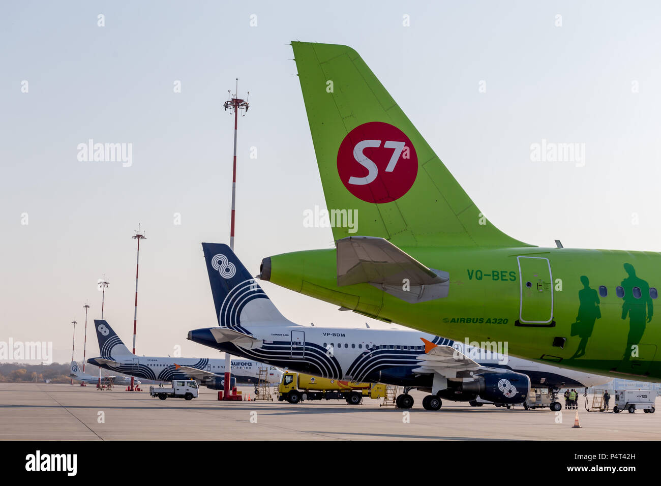 Russia, Vladivostok, 10/13/2017. Passenger jets of S7 Airlines and Aurora Airlines on airfield. Airplane fuselages. Aviation and transportation. Stock Photo