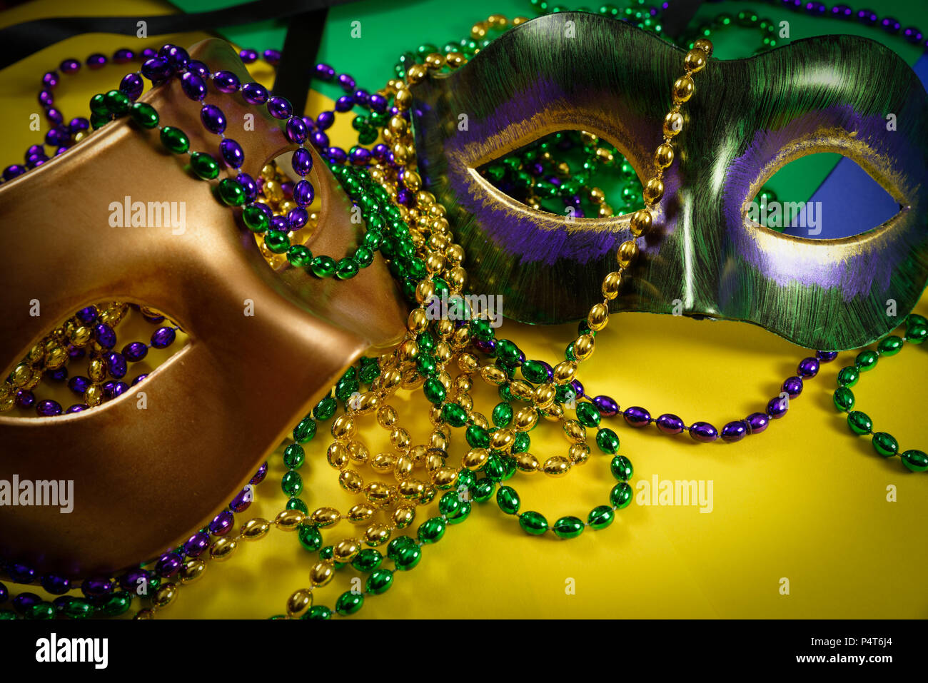 Download Two Mardi Gras Mask With Colorful Beads On A Yellow Background Stock Photo Alamy PSD Mockup Templates