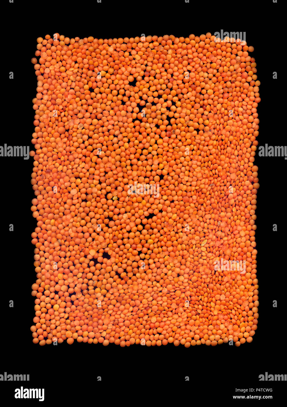 Background of lentil red fruits on a black background Stock Photo