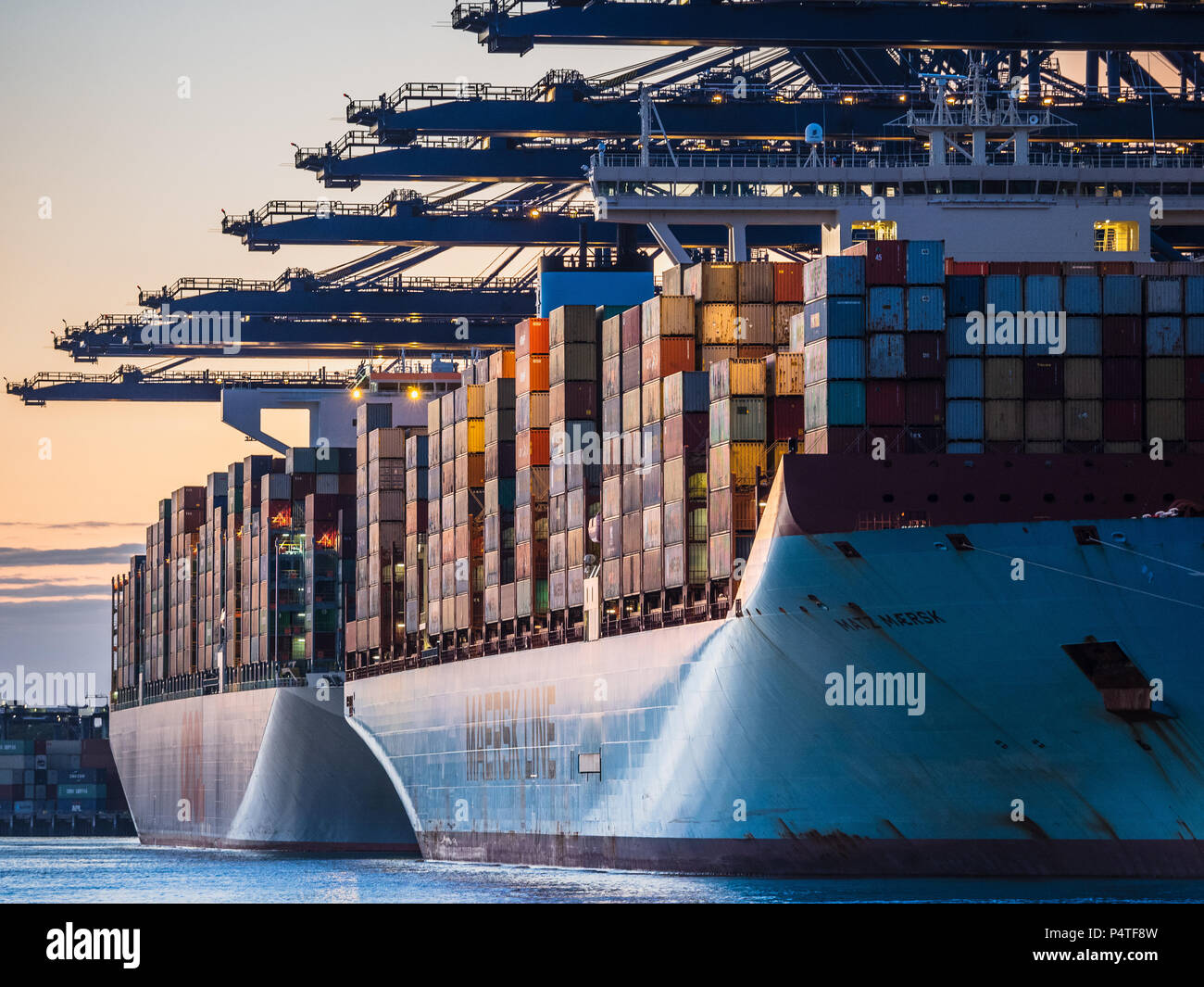 International Trade, World Trade. Container ships unload and load containers at the Port of Felixstowe, the UK's largest container port. Stock Photo