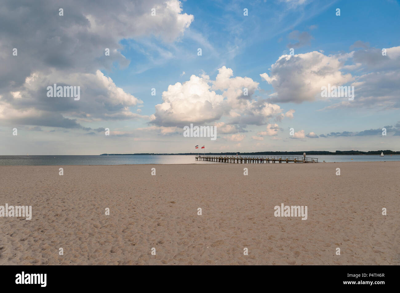 Empty sandy beach and pier, cloudy sky, Travemünde, Baltic Sea, Schleswig-Holstein, Germany Stock Photo